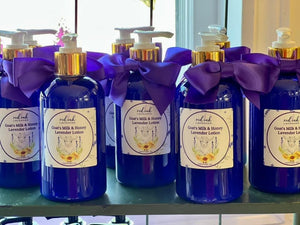 goats milk and lavender in blue bottles on shelf